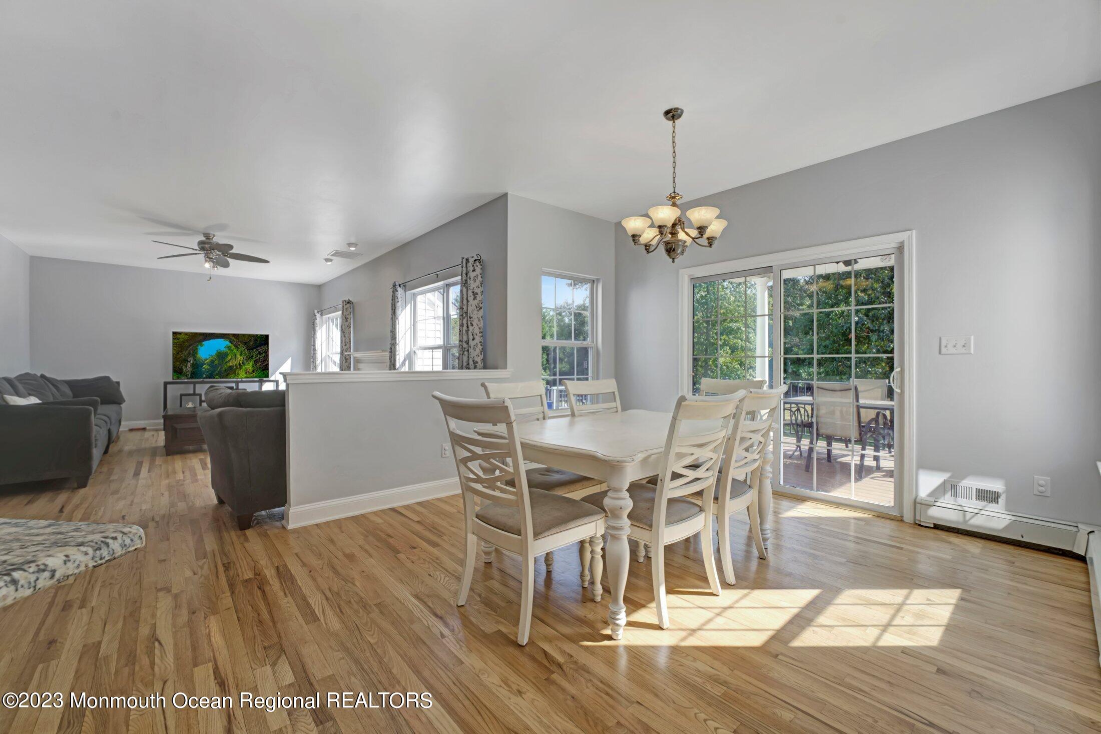 601 Reed Road Jackson, NJ 08527 - Photo 14 of 43 a view of a dining room with furniture window and wooden floor