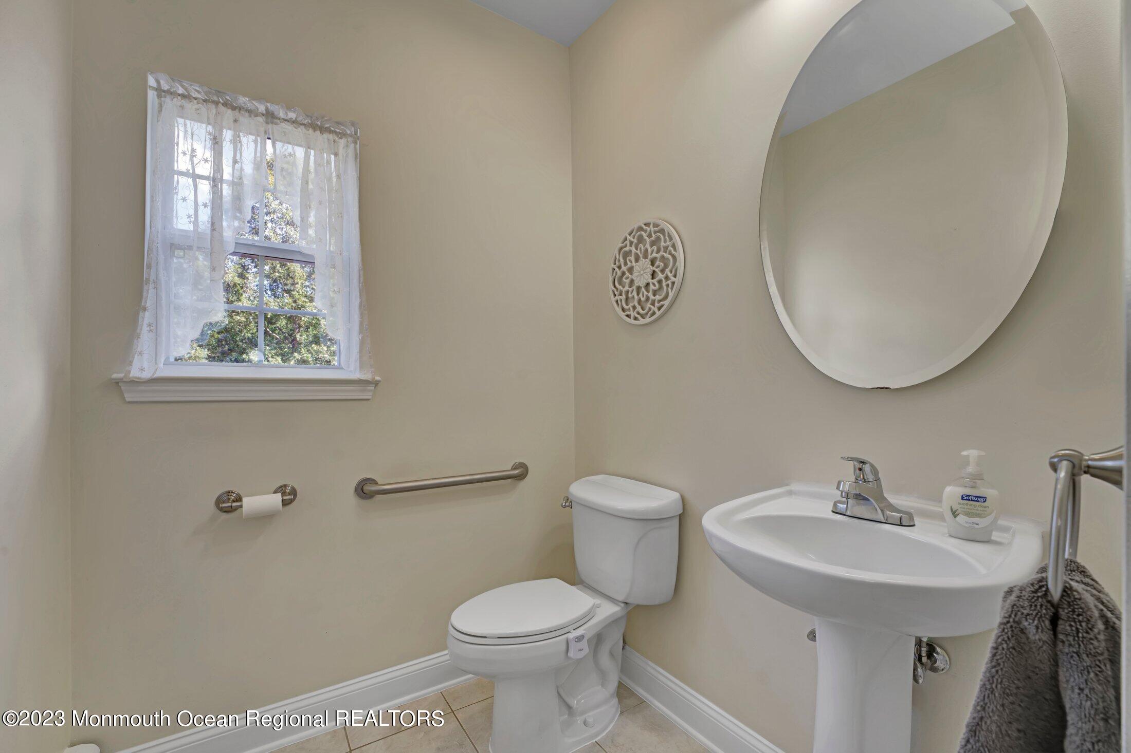 601 Reed Road Jackson, NJ 08527 - Photo 18 of 43 a bathroom with a toilet sink and mirror