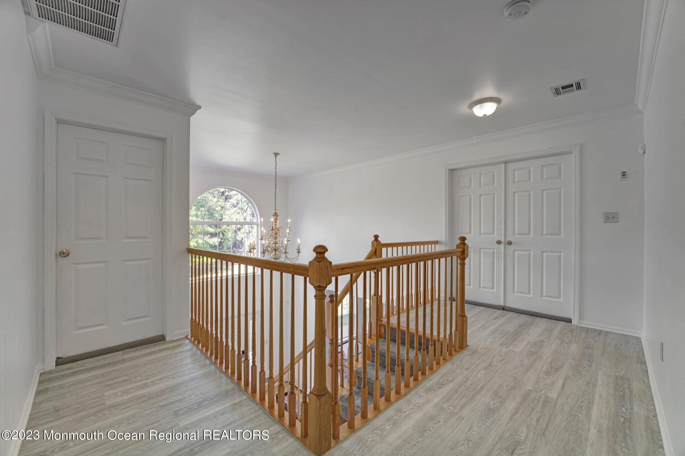 601 Reed Road Jackson, NJ 08527 - Photo 19 of 43 a view of a hallway with windows