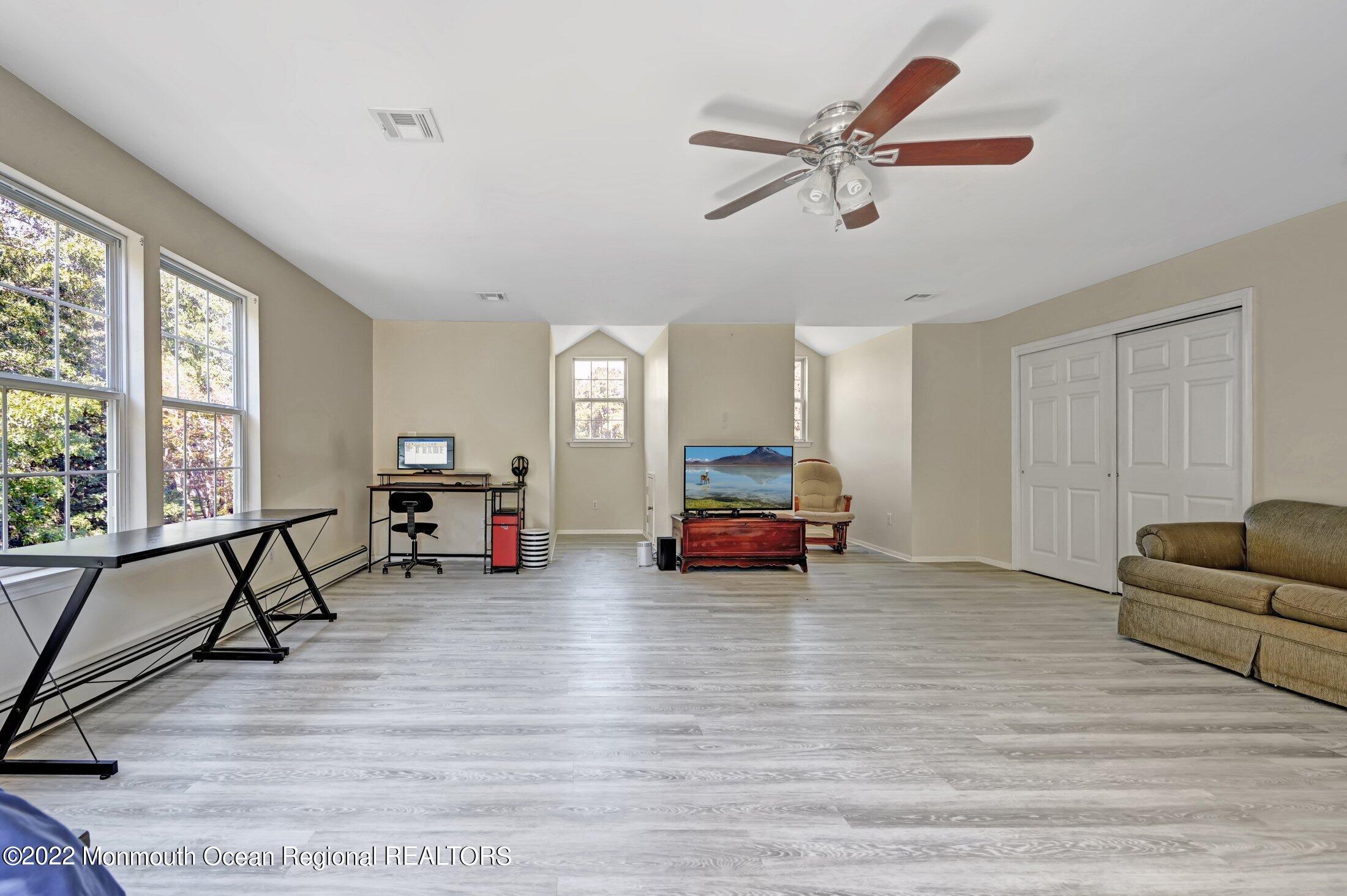 601 Reed Road Jackson, NJ 08527 - Photo 29 of 43 a living room with furniture and a wooden floor