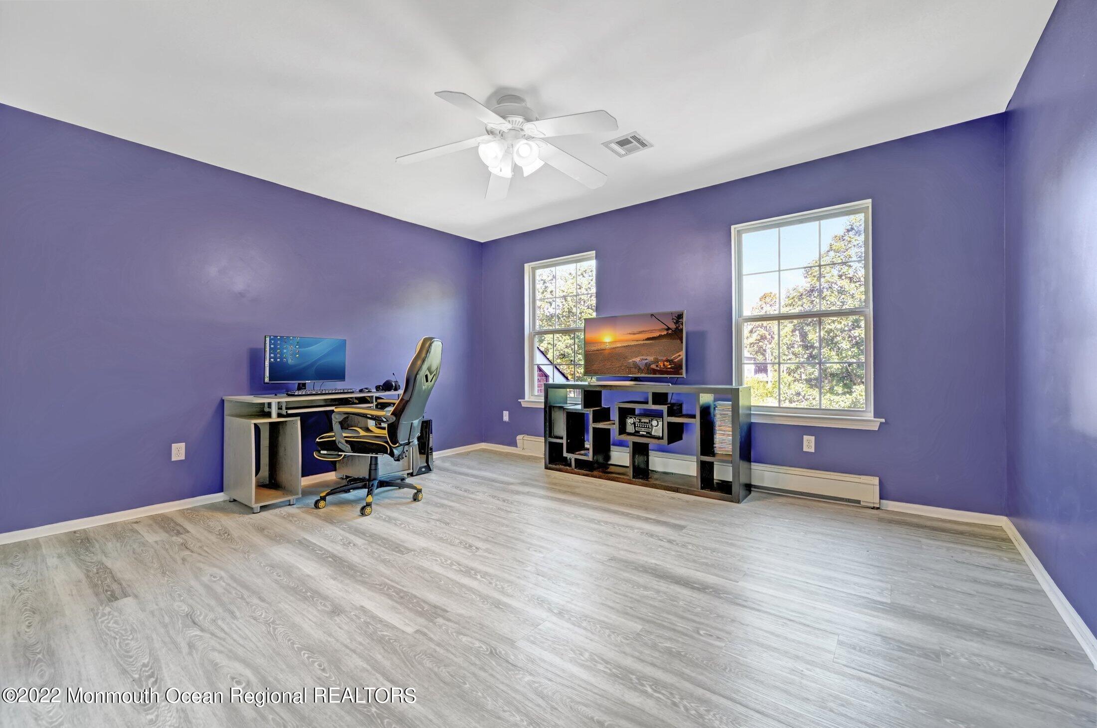601 Reed Road Jackson, NJ 08527 - Photo 30 of 43 a workspace with furniture window and wooden floor