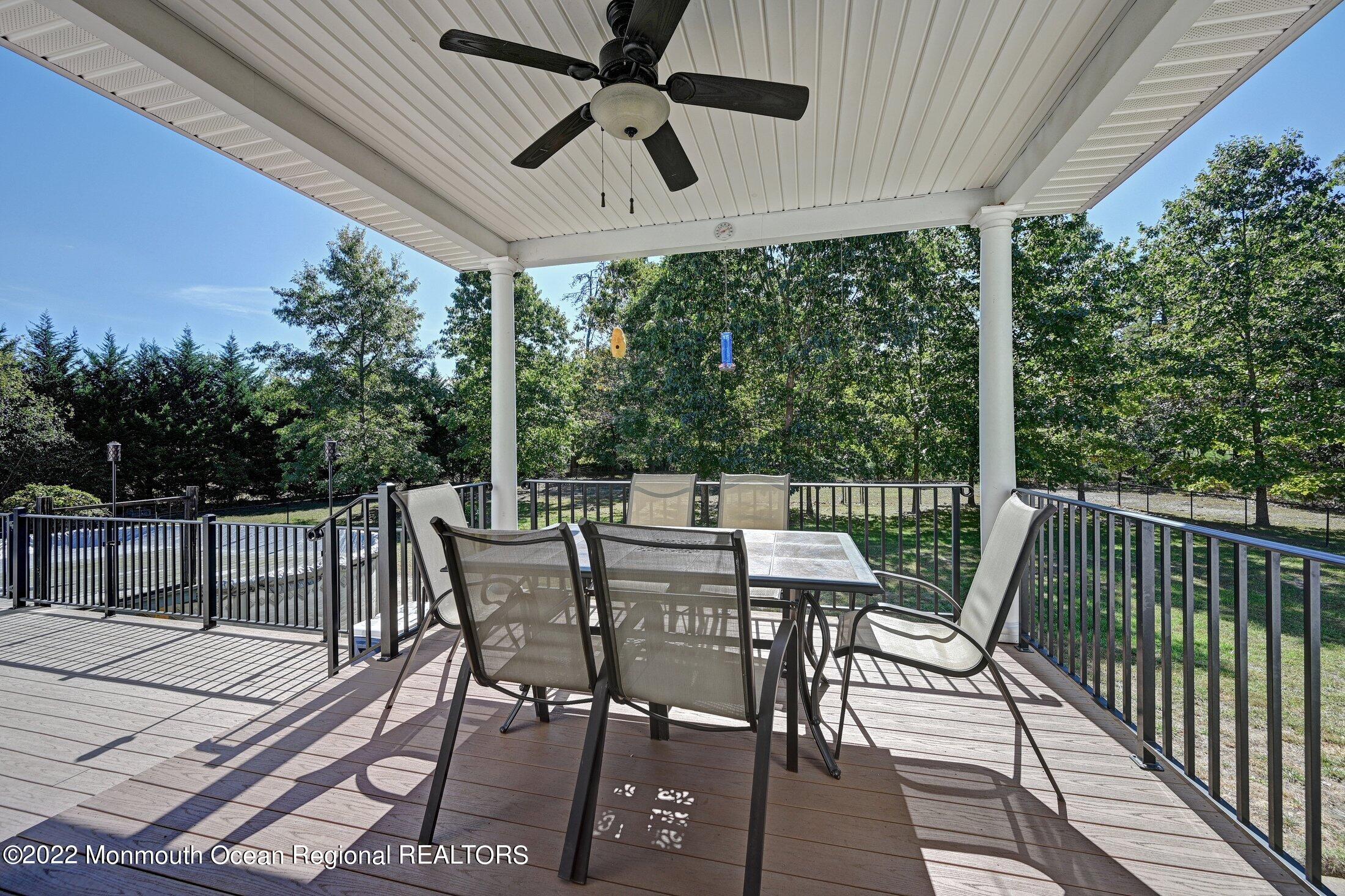601 Reed Road Jackson, NJ 08527 - Photo 34 of 43 a view of a patio with a table chairs and backyard