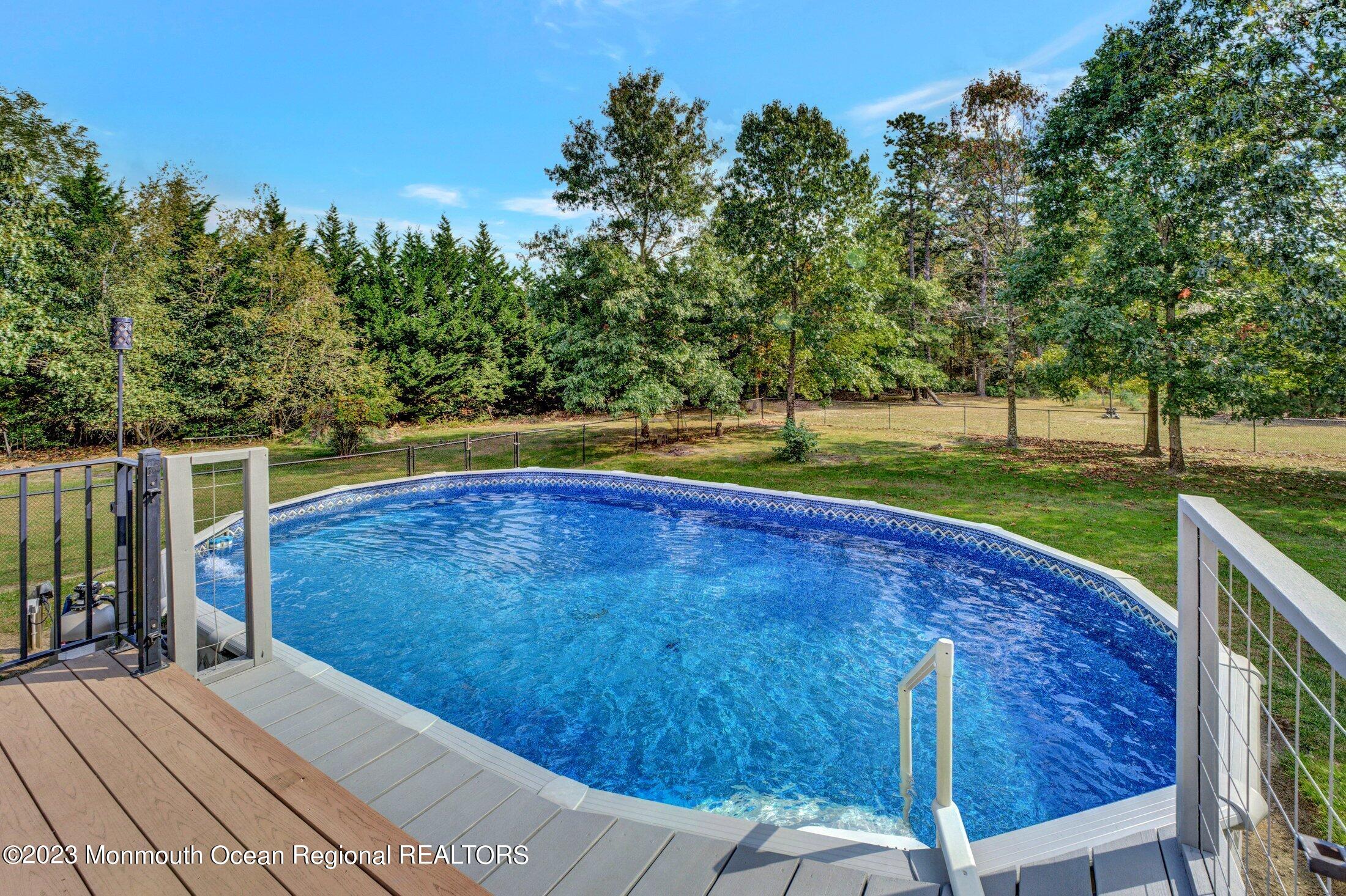 601 Reed Road Jackson, NJ 08527 - Photo 42 of 43 a view of a swimming pool with a yard