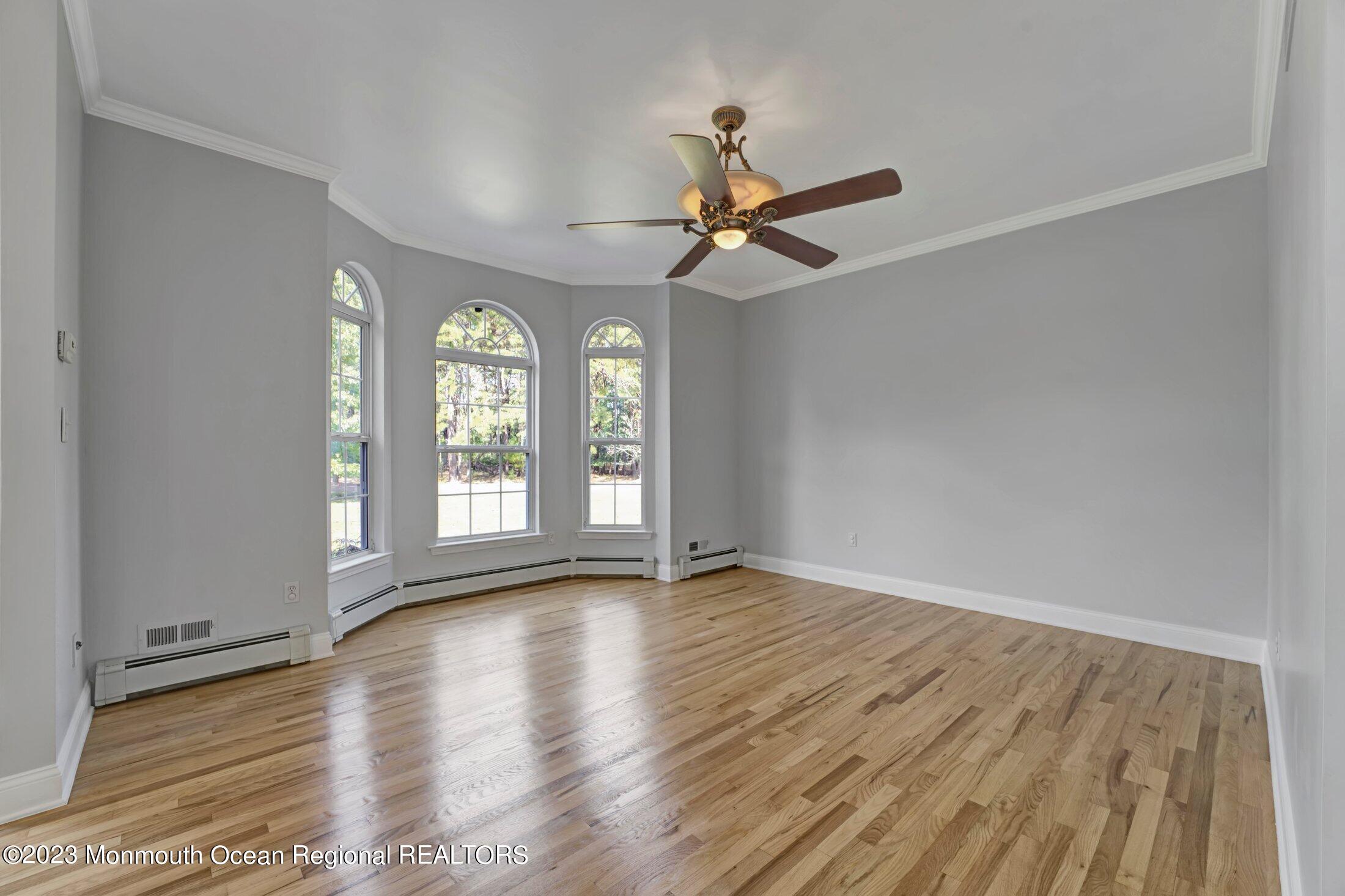 601 Reed Road Jackson, NJ 08527 - Photo 6 of 43 a view of room with window ceiling fan and hardwood floor