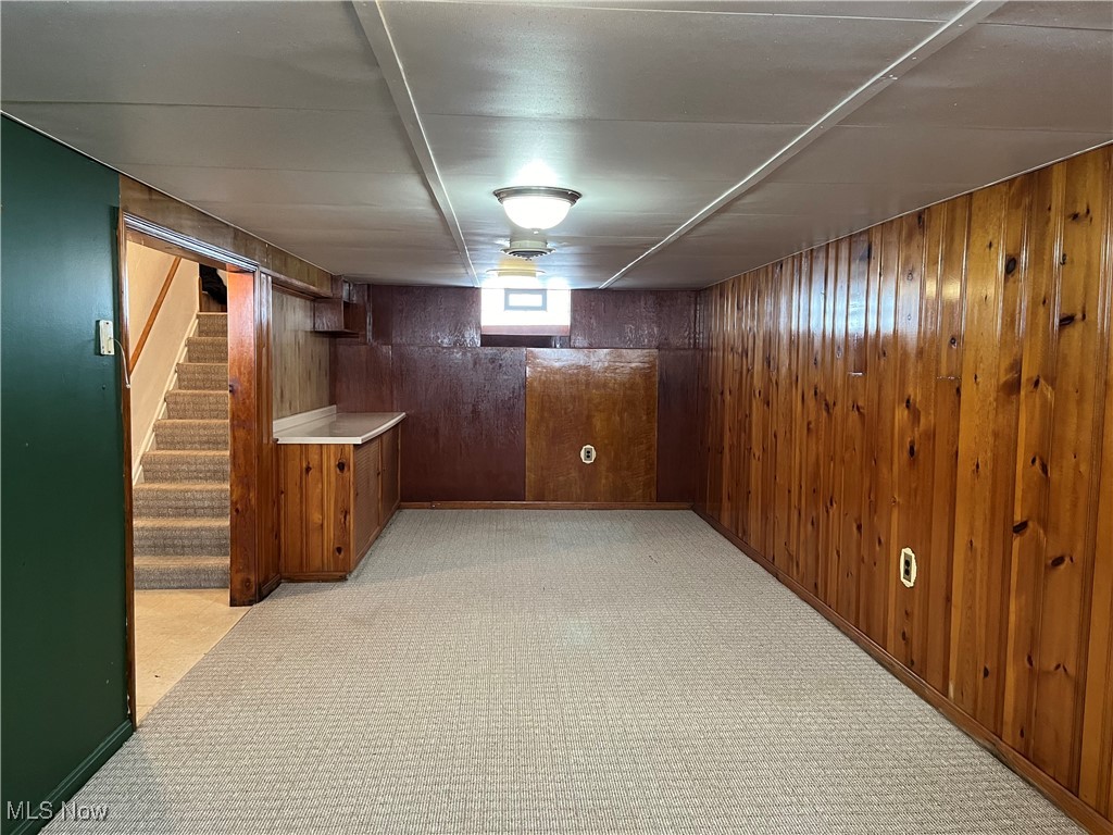 15405 Corkhill Road Maple Heights, OH 44137 - Photo 38 of 50 Rec Room is carpeted and has knotty pine walls.