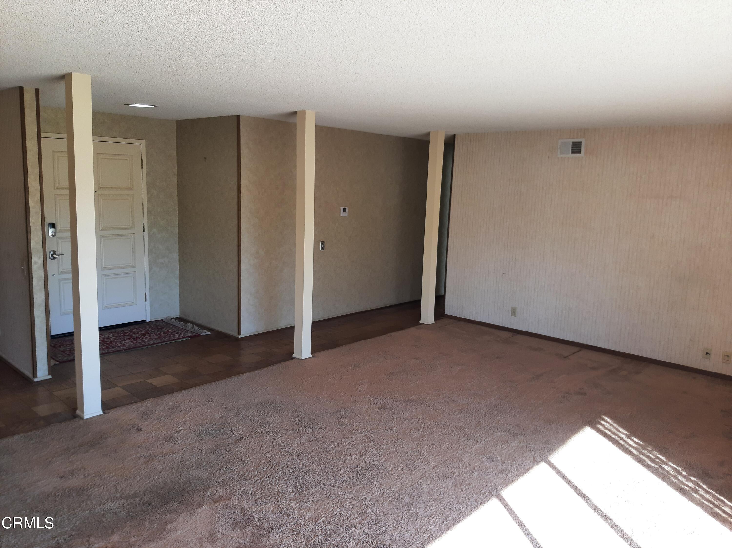 3166 Old Coach Drive Camarillo, CA 93010 - Photo 11 of 55 a view of a livingroom with an empty space and windows