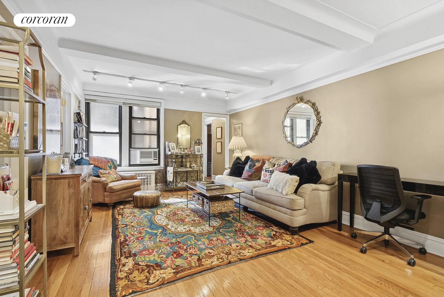 308 East 79th Street, Unit 7F Manhattan, NY 10075 - Photo 1 of 17 a living room with furniture and wooden floor