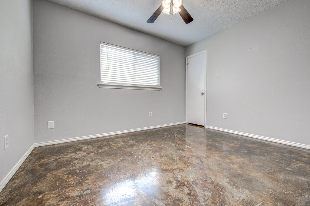 12925 Covington Trail Austin, TX 78727 - Photo 11 of 28 Unfurnished room featuring a textured ceiling and a ceiling fan