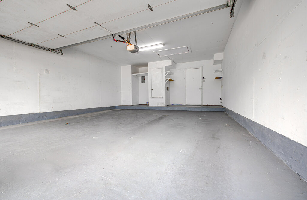 12925 Covington Trail Austin, TX 78727 - Photo 10 of 28 Garage with a garage door opener