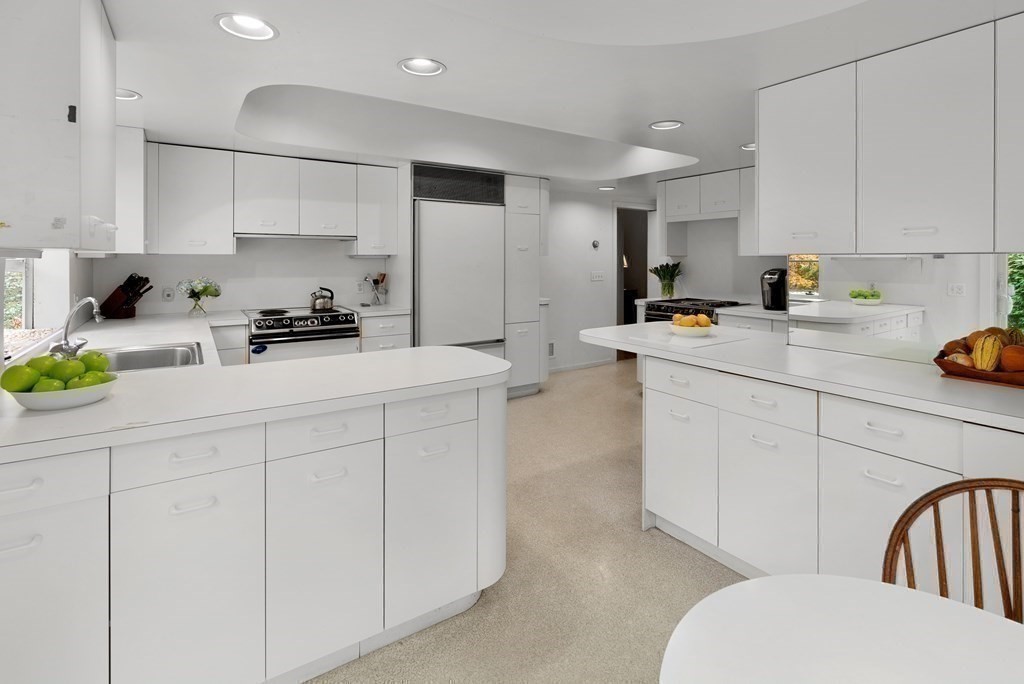 260 Lee Street Brookline, MA 02445 - Photo 11 of 22 a kitchen with white cabinets and appliances