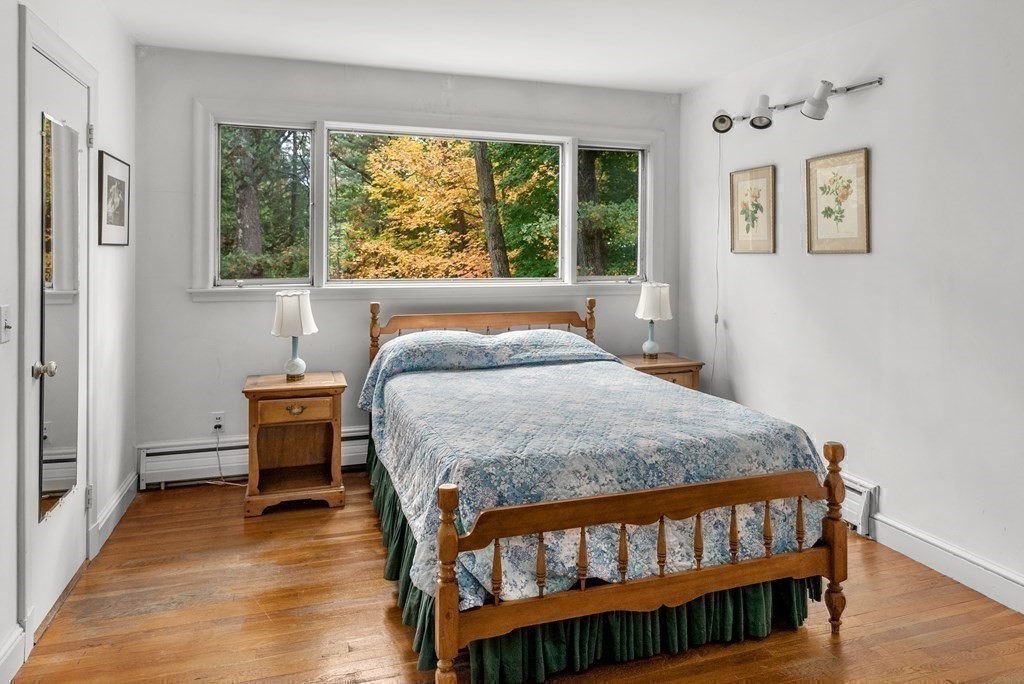 260 Lee Street Brookline, MA 02445 - Photo 15 of 22 a bedroom with a bed window and a table in it