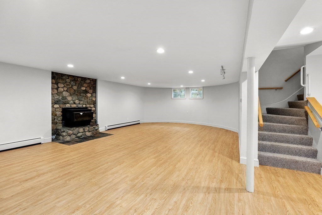 260 Lee Street Brookline, MA 02445 - Photo 17 of 22 a view of an empty room with stairs and a window