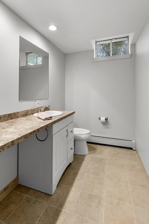 260 Lee Street Brookline, MA 02445 - Photo 18 of 22 a utility room with a sink a toilet and mirror