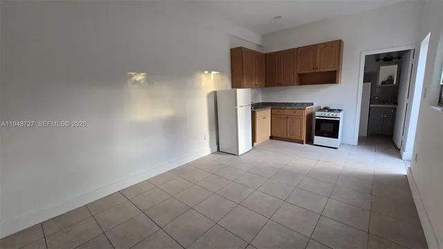 a view of a kitchen with a sink and a stove