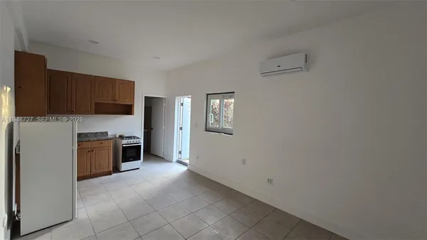 a kitchen with a refrigerator stove and microwave