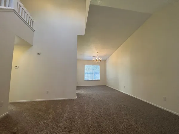 a view of an empty room and a window