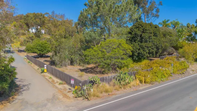 a view of a lake with a house in the background