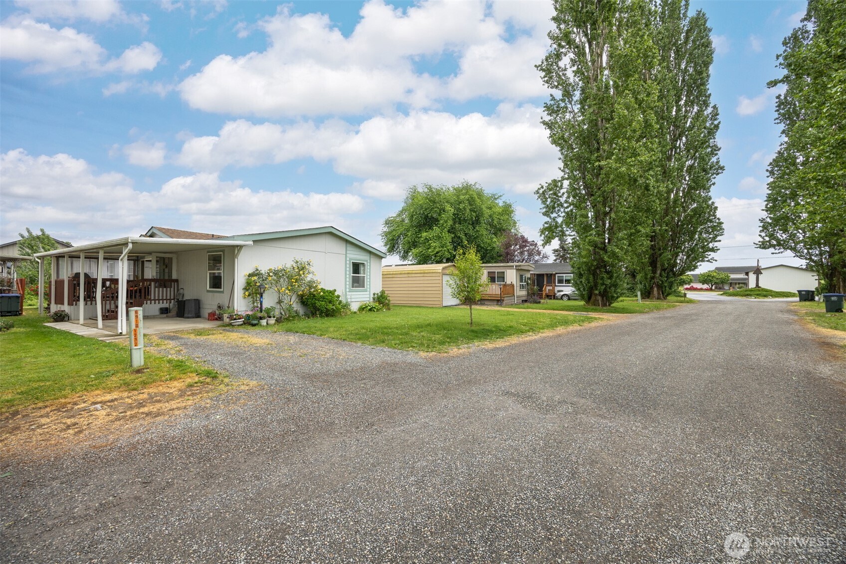 380 East Pole Road, Unit 6 Lynden, WA 98264 - Photo 40 of 40 a view of a house with a big yard and large trees