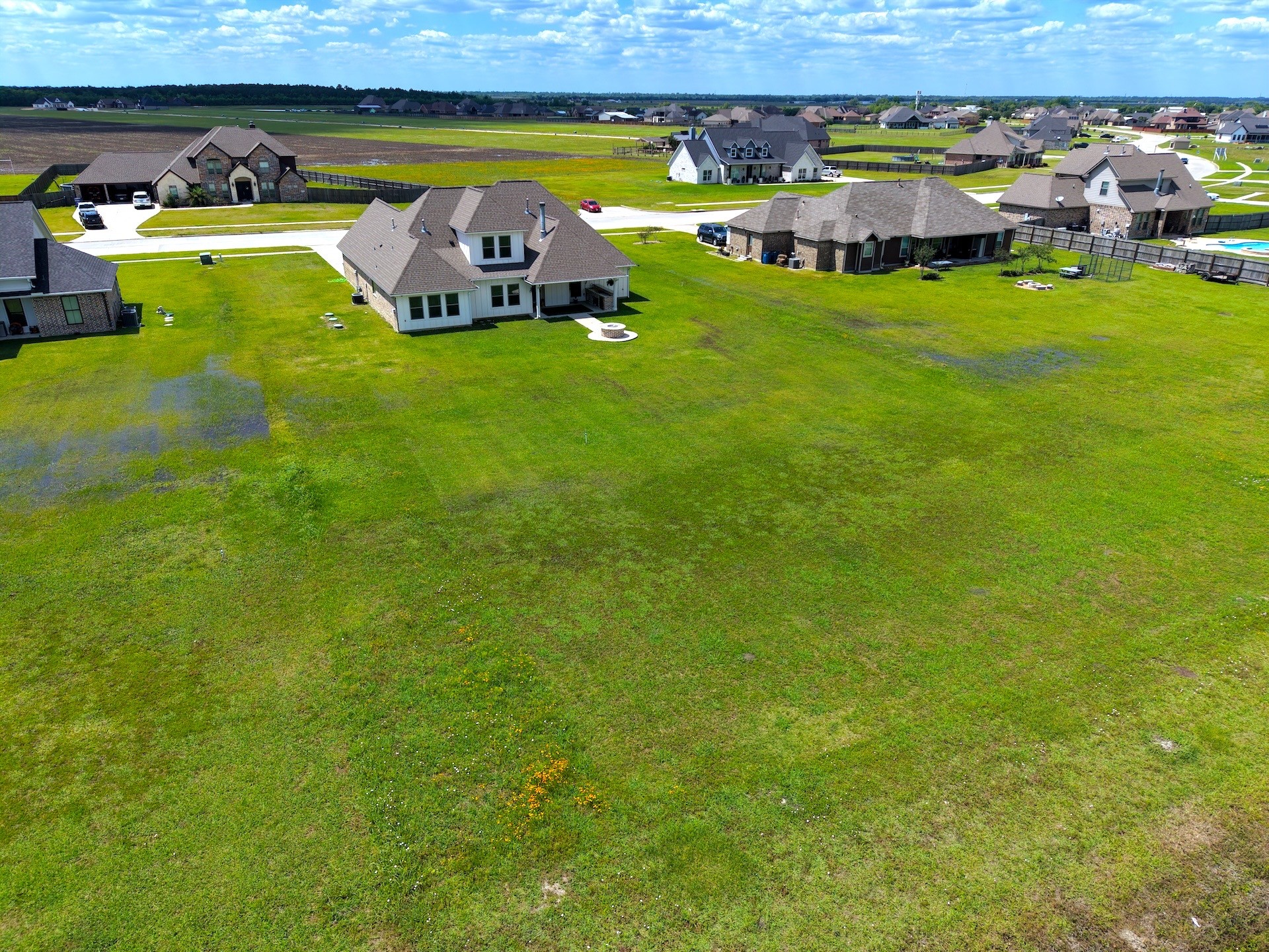 2295 Diamond D Lane Beaumont, TX 77713 - Photo 31 of 40 a large body of water with a building in the background