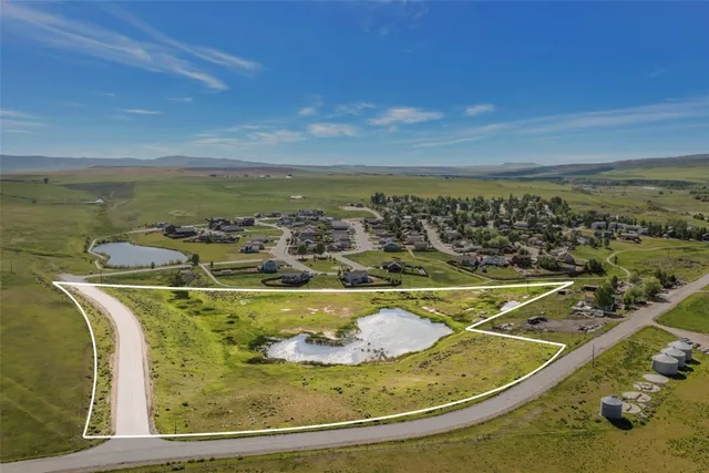 a view of a swimming pool with a table and chairs