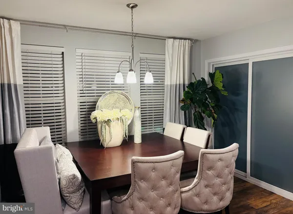 a view of a dining room with furniture and window