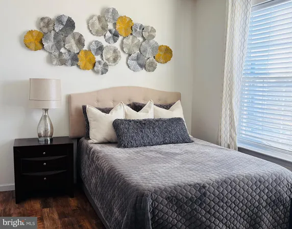 a bedroom with a bed and window