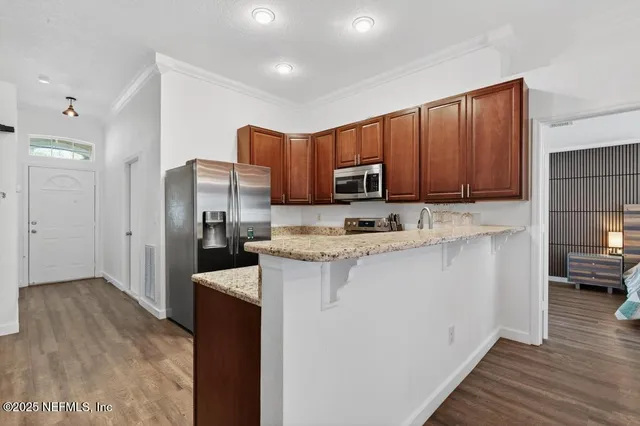 a stove top oven sitting inside of a kitchen