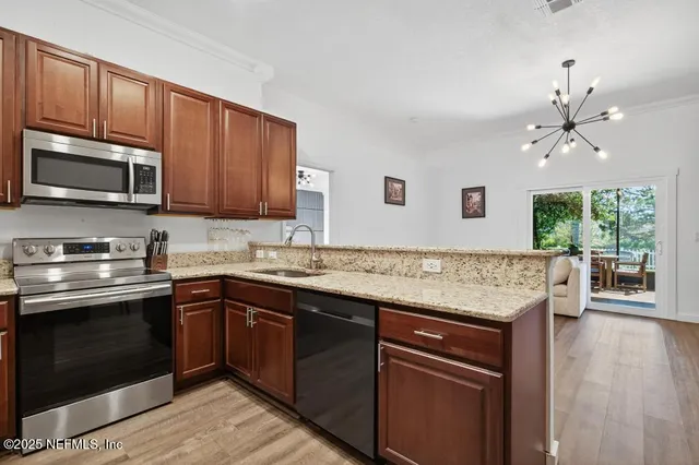 a kitchen with a sink and a microwave