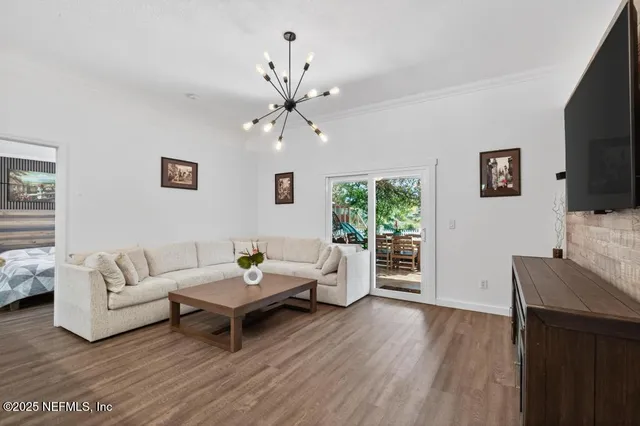 a living room with flat screen tv a fireplace and a flat screen tv