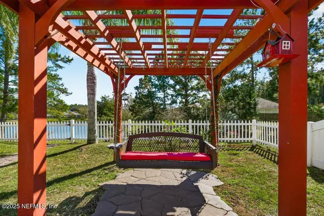 a view of a garden with a small yard and palm trees