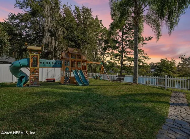a view of a park with swings and slides