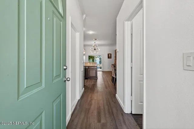 a view of a workspace with furniture and wooden floor