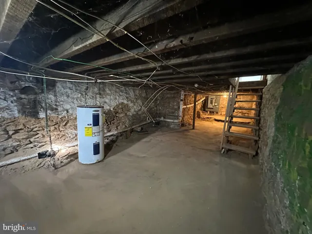 a view of empty room with wooden walls