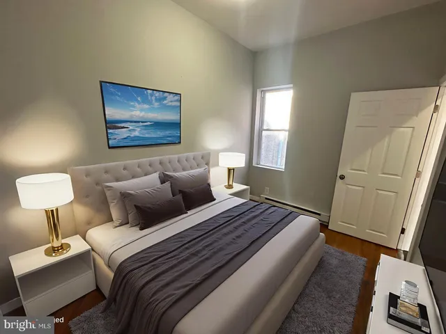 a bedroom with bed dresser and a window