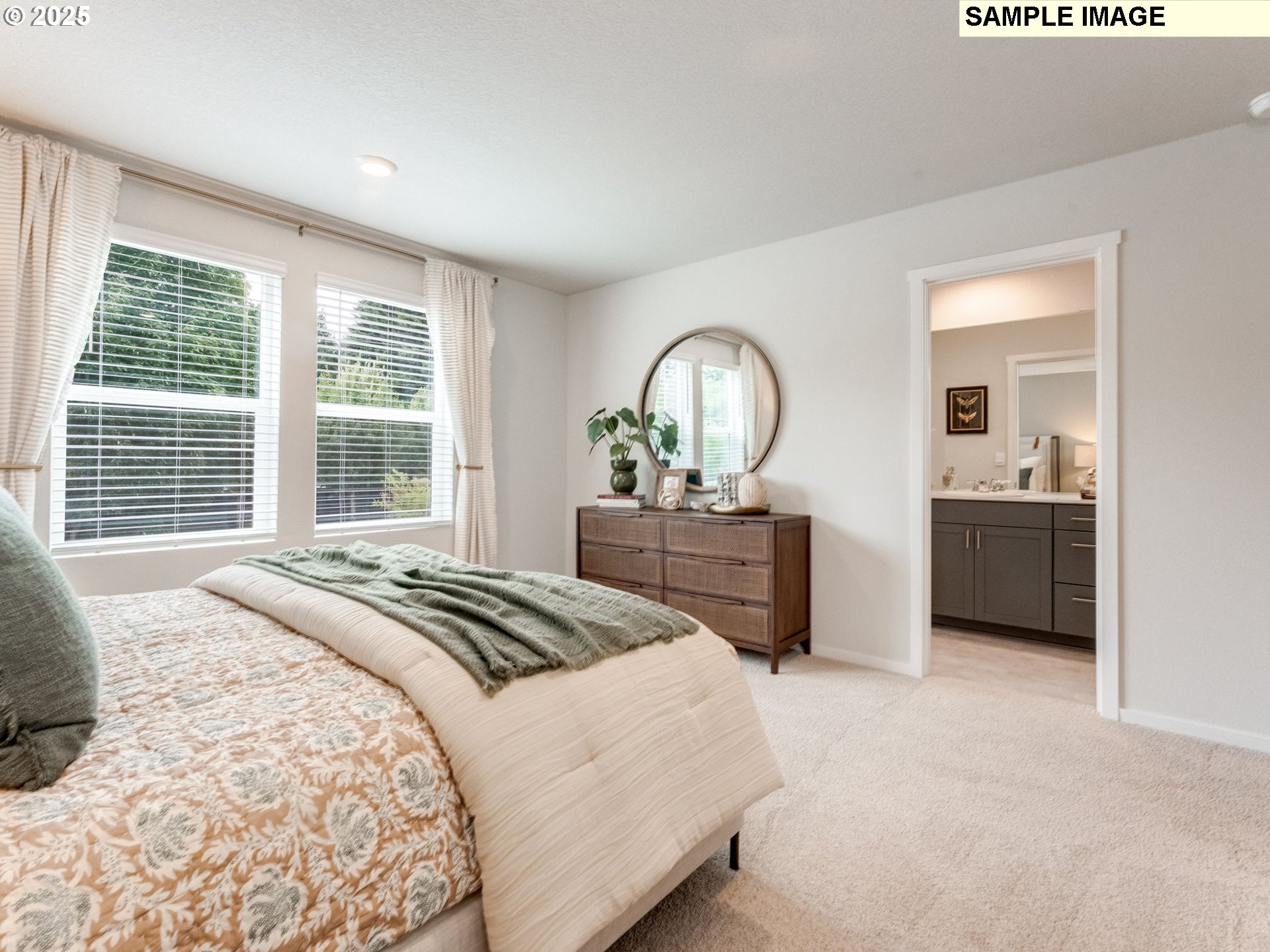 11114 Southeast Maxon Road Vancouver, WA 98664 - Photo 17 of 24 a bedroom with a bed and a view of bathroom