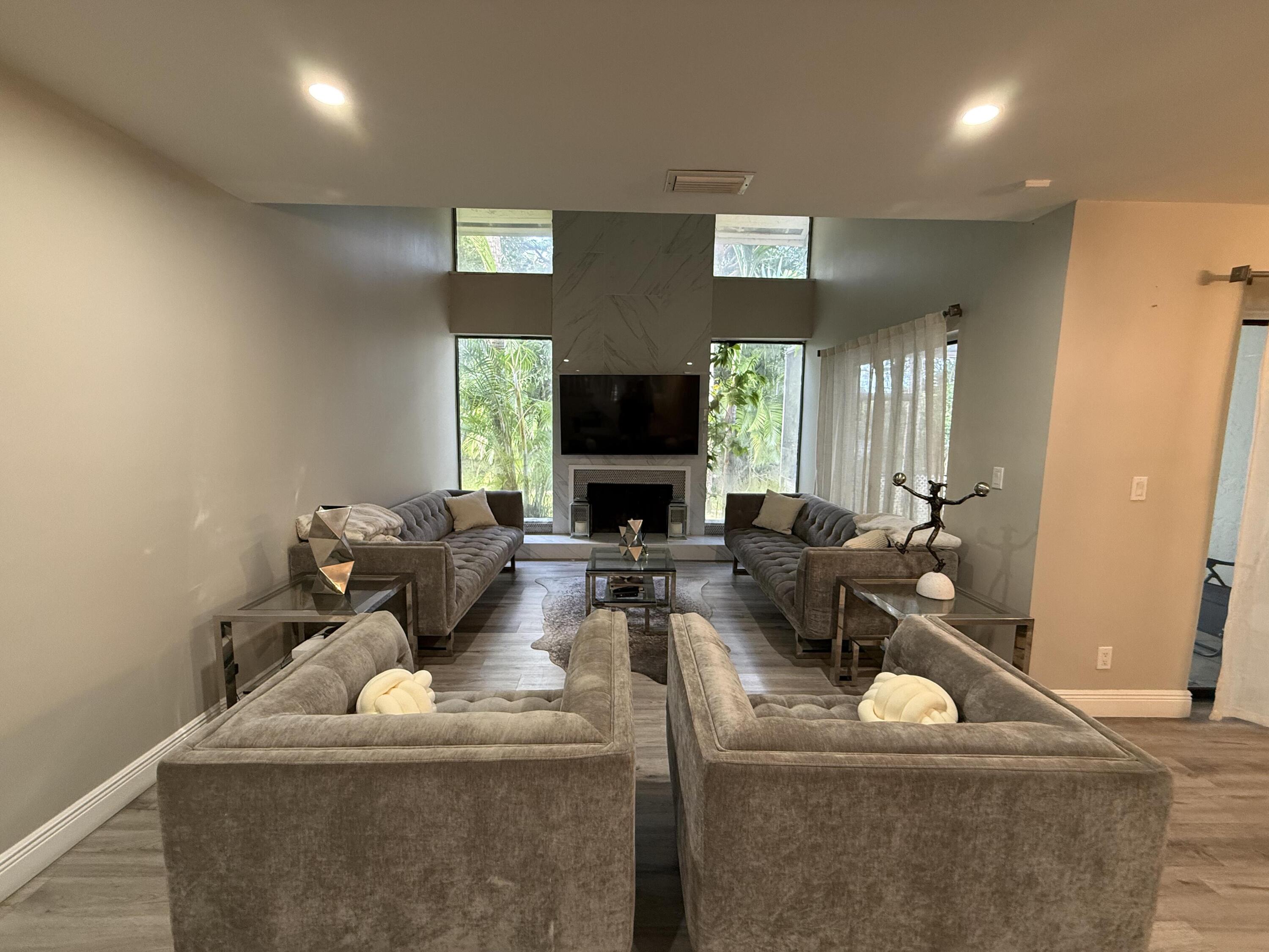 22874 Ironwedge Drive Boca Raton, FL 33433 - Photo 11 of 52 a living room with furniture and a fireplace