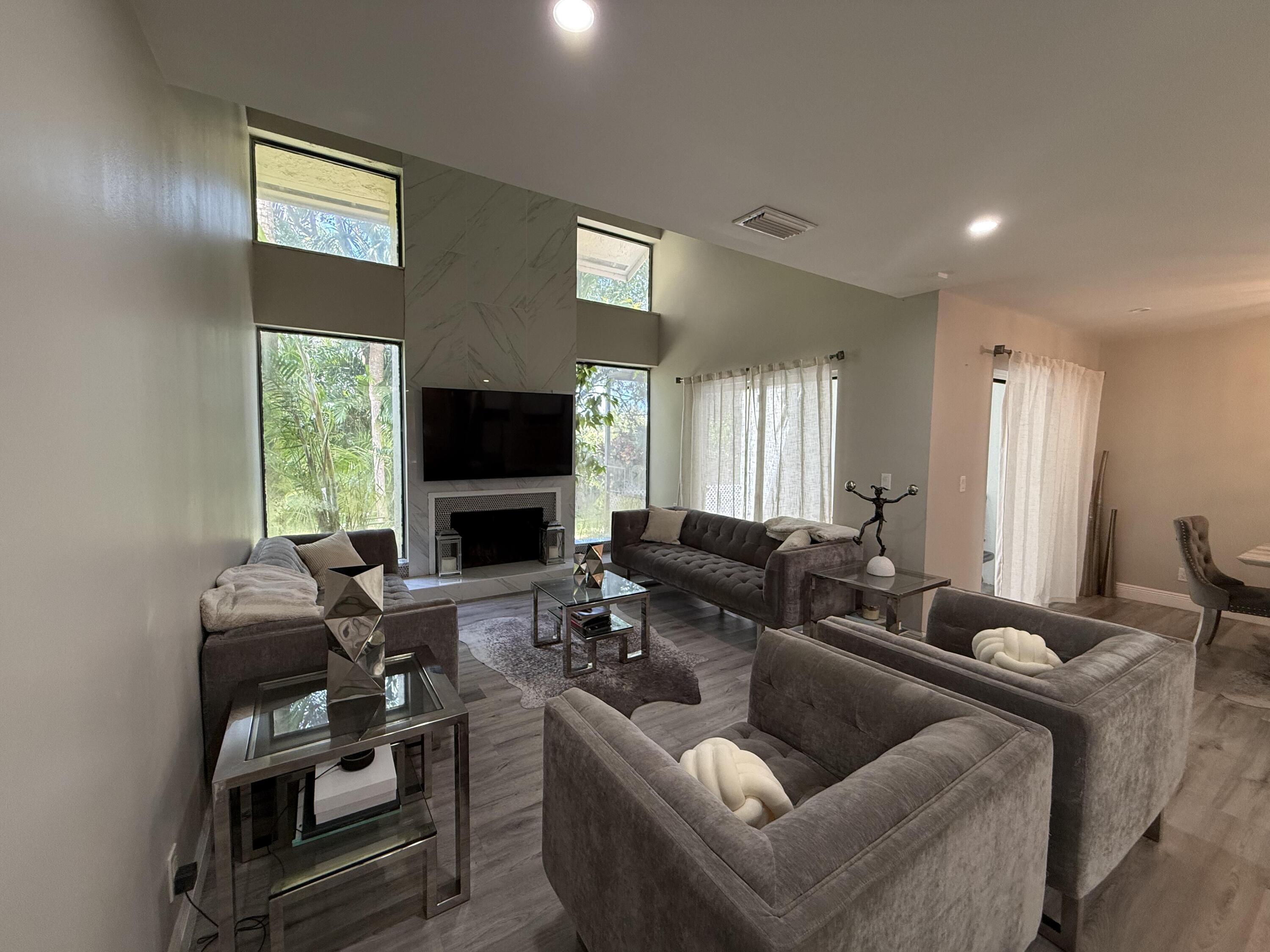 22874 Ironwedge Drive Boca Raton, FL 33433 - Photo 12 of 52 a living room with furniture fireplace and window