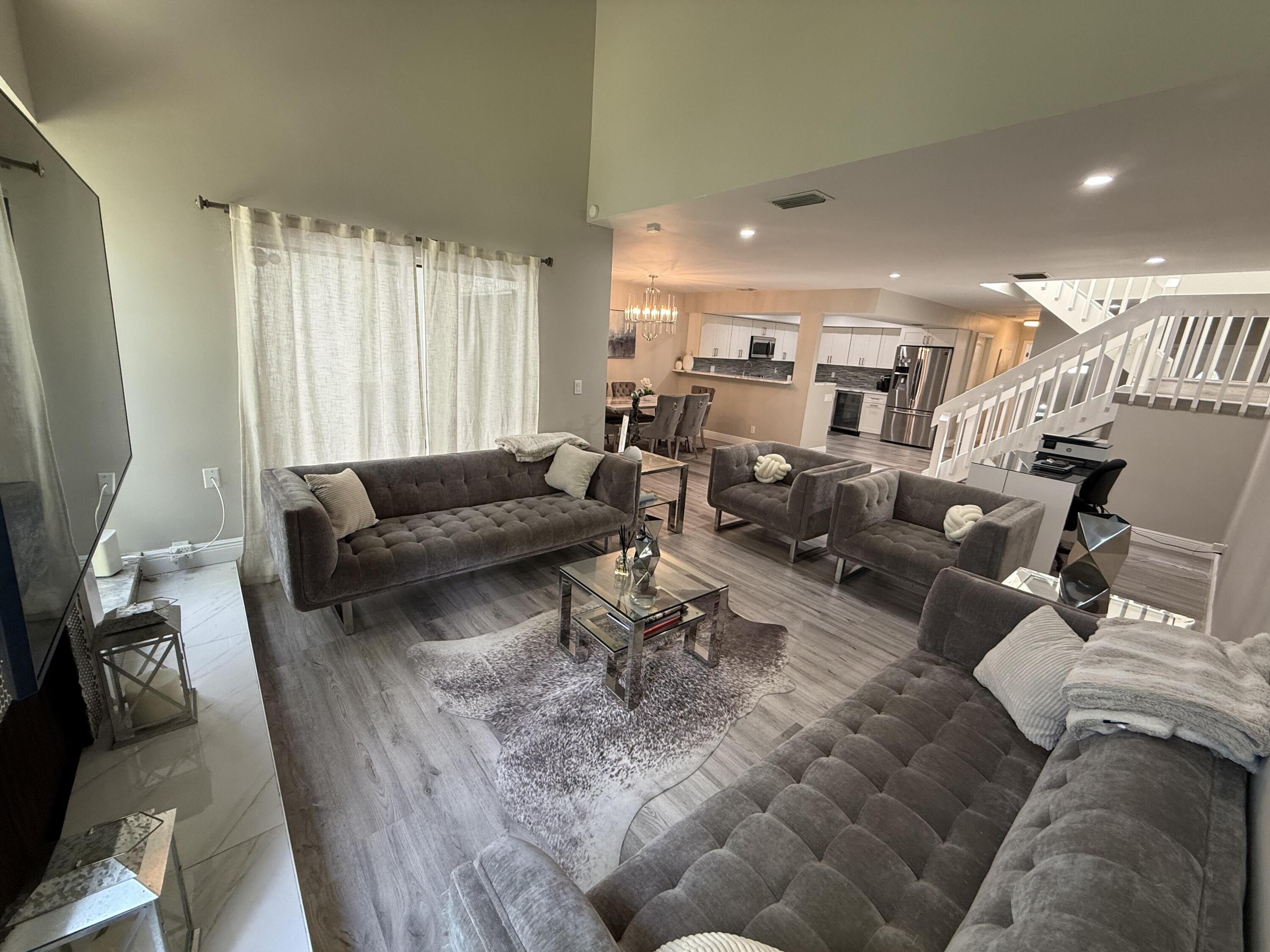 22874 Ironwedge Drive Boca Raton, FL 33433 - Photo 16 of 52 a living room with furniture and a large window