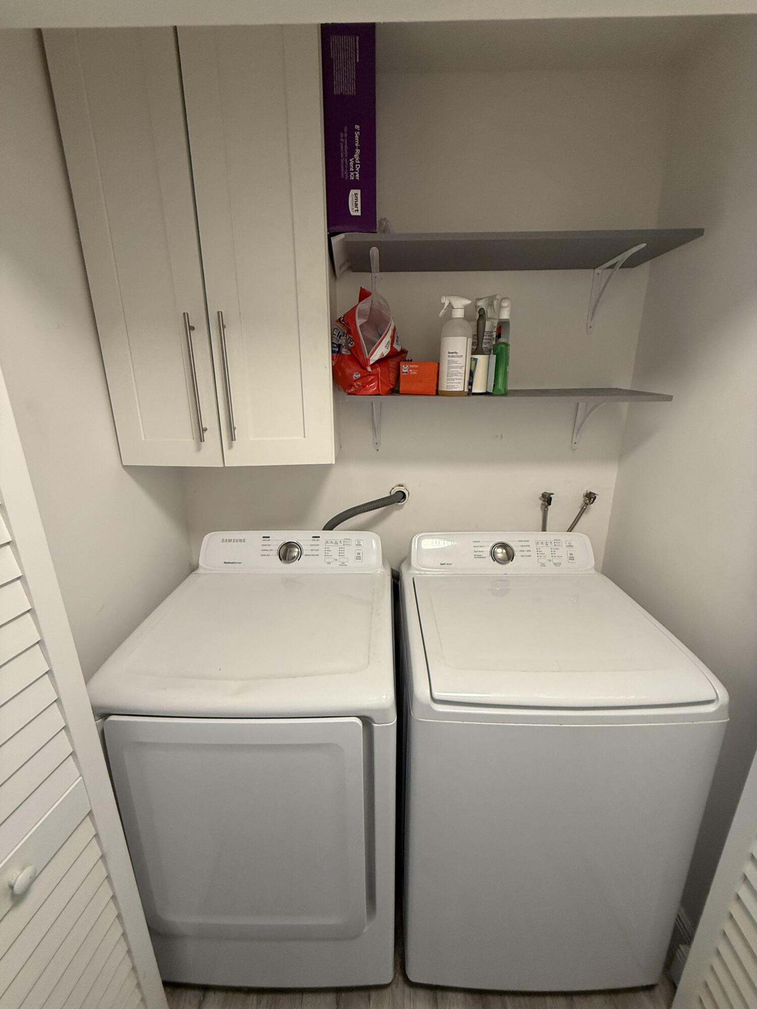 22874 Ironwedge Drive Boca Raton, FL 33433 - Photo 17 of 52 a utility room with dryer and washer