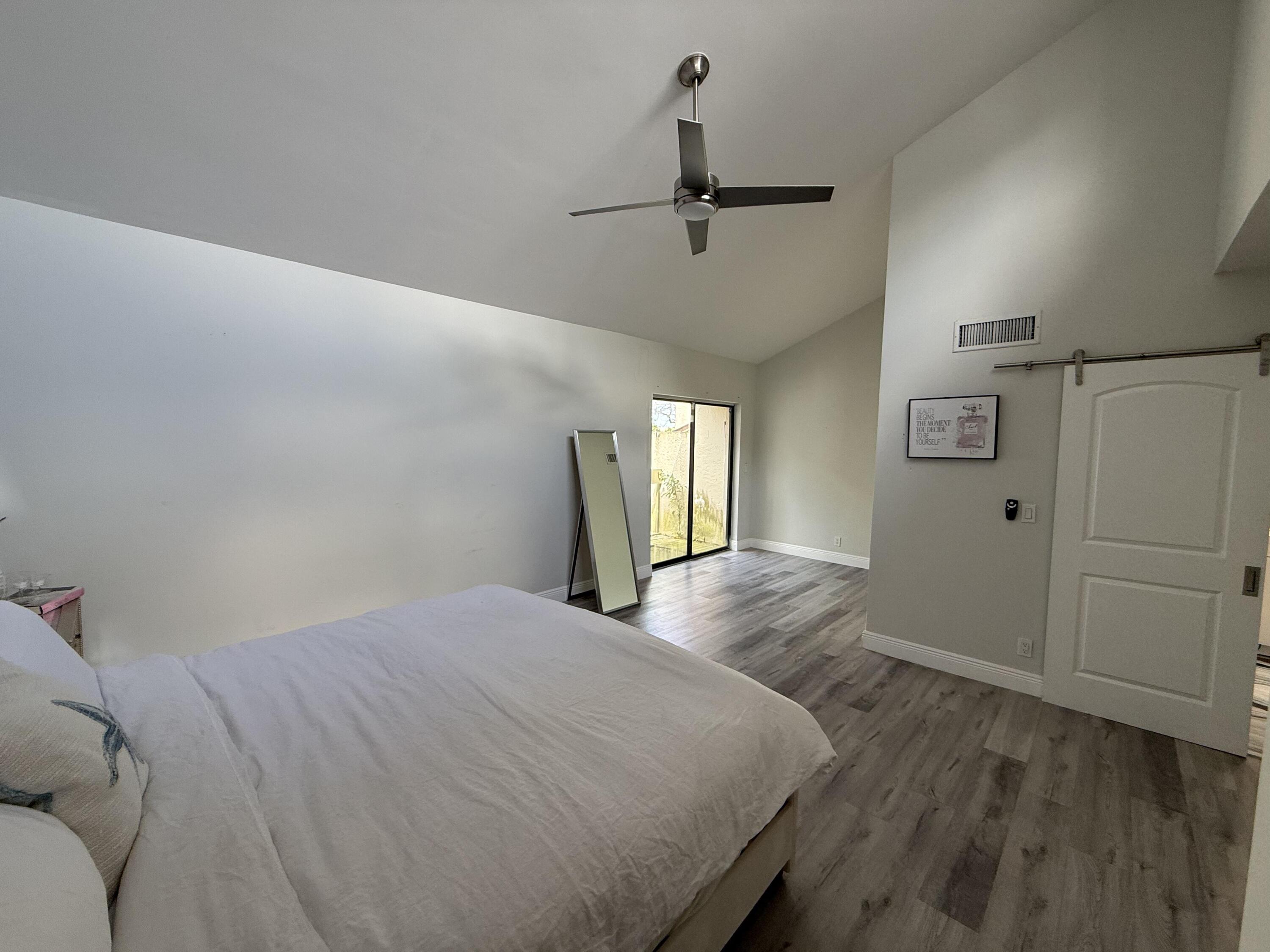 22874 Ironwedge Drive Boca Raton, FL 33433 - Photo 23 of 52 a bedroom with a bed and a window