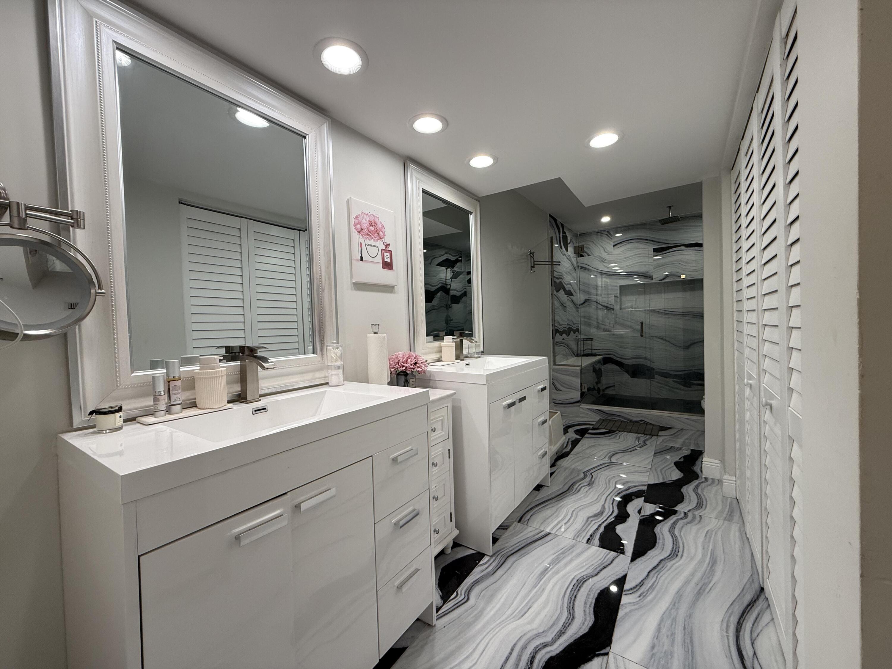 22874 Ironwedge Drive Boca Raton, FL 33433 - Photo 25 of 52 a bathroom with a double vanity sink mirror and toilet