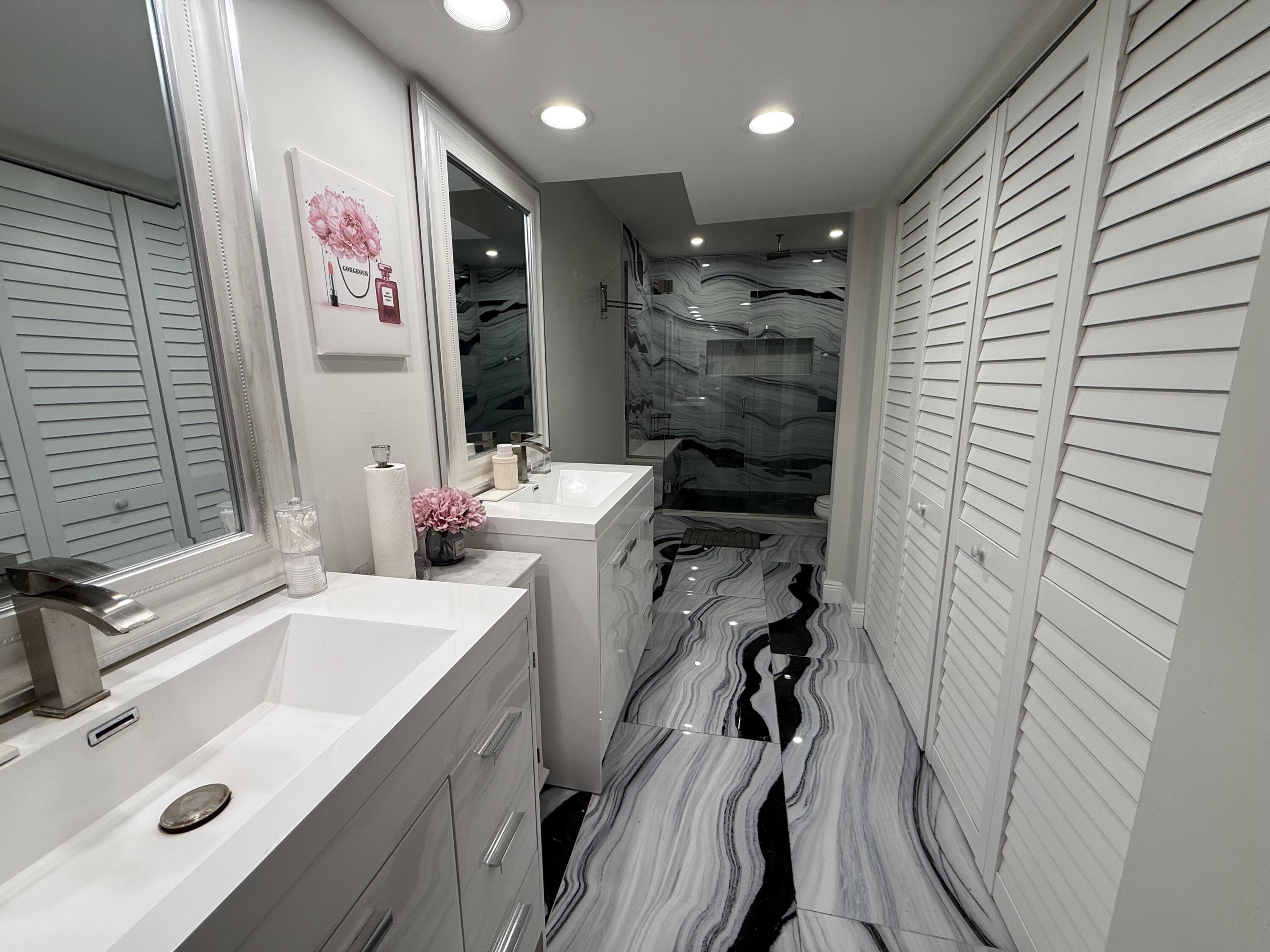 22874 Ironwedge Drive Boca Raton, FL 33433 - Photo 26 of 52 a bathroom with a sink a vanity and a mirror