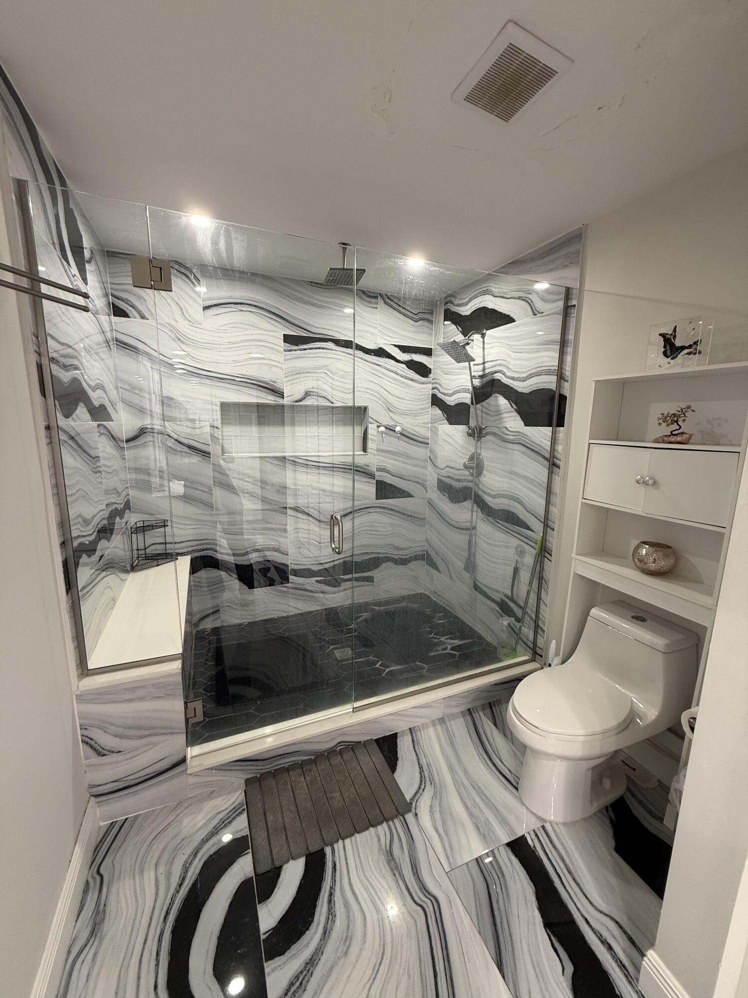 22874 Ironwedge Drive Boca Raton, FL 33433 - Photo 29 of 52 a bathroom with a toilet and a shower