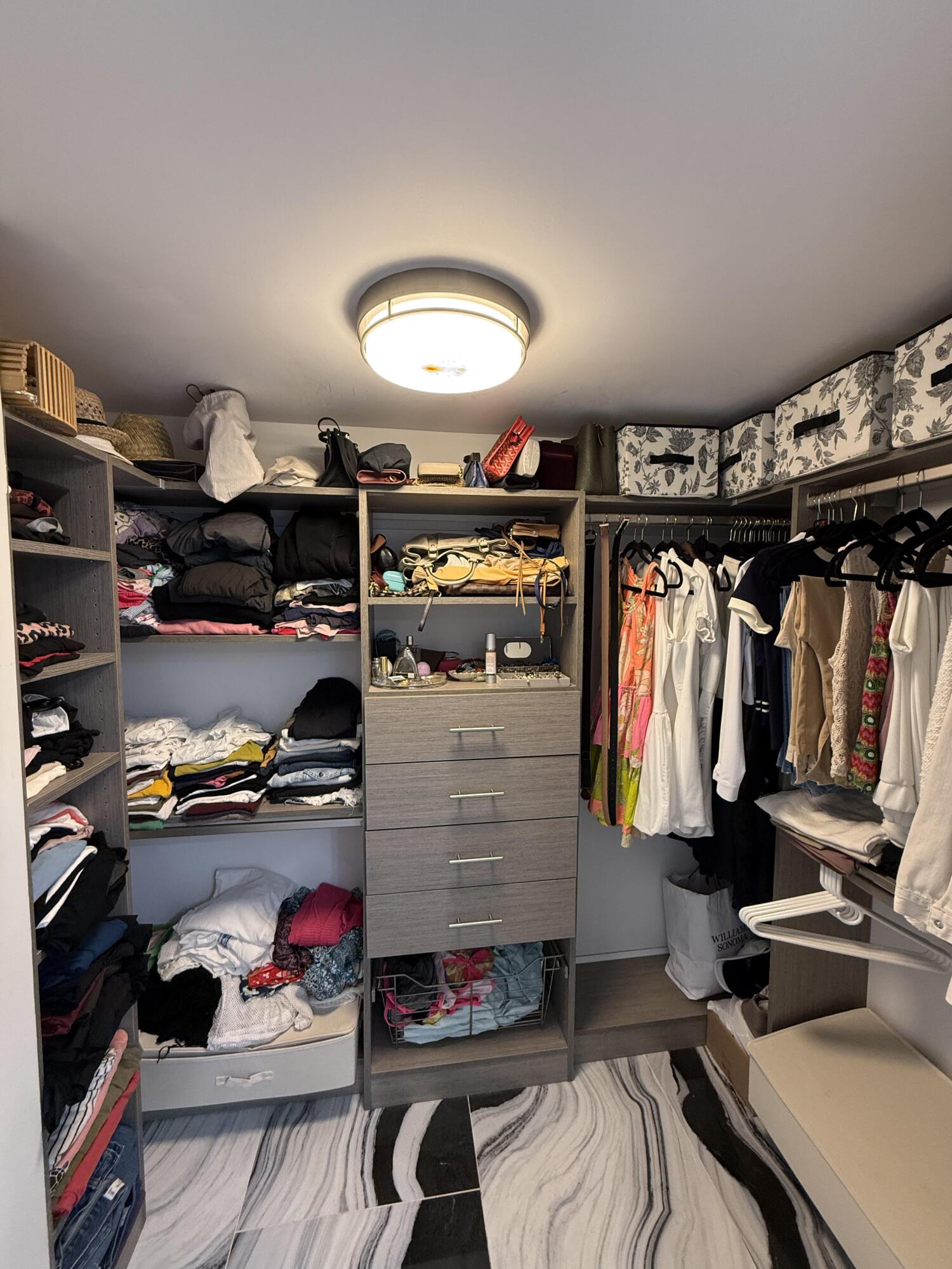 22874 Ironwedge Drive Boca Raton, FL 33433 - Photo 30 of 52 a view of walk in closet with clothes and shoes