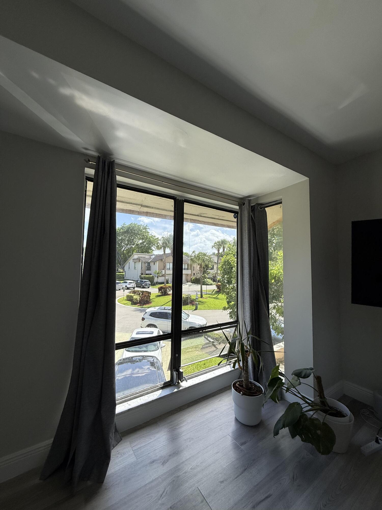22874 Ironwedge Drive Boca Raton, FL 33433 - Photo 42 of 52 wooden floor in an empty room with a window