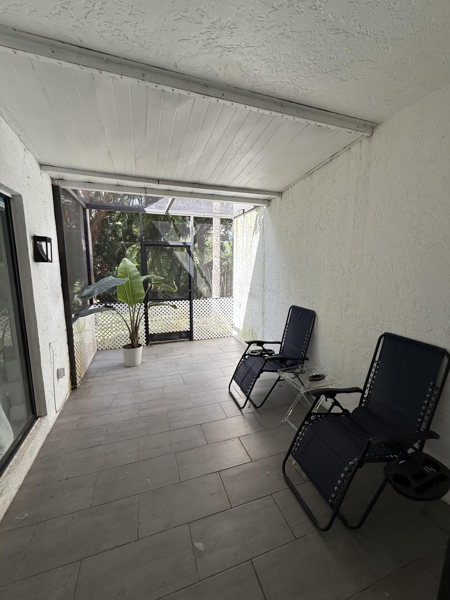 22874 Ironwedge Drive Boca Raton, FL 33433 - Photo 43 of 52 a living room with furniture and a window