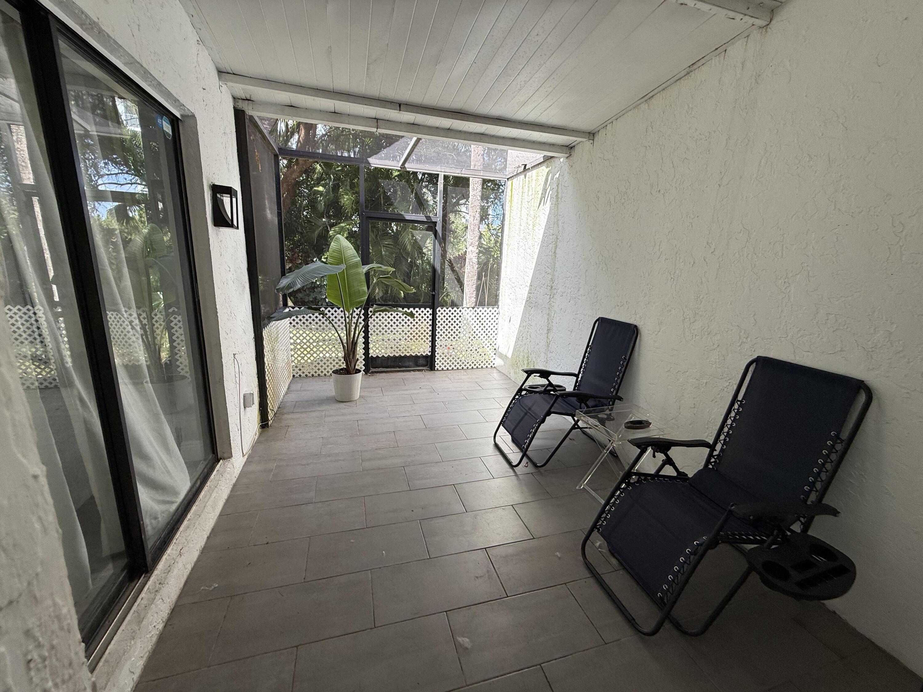 22874 Ironwedge Drive Boca Raton, FL 33433 - Photo 44 of 52 a view of a workspace with furniture and a window