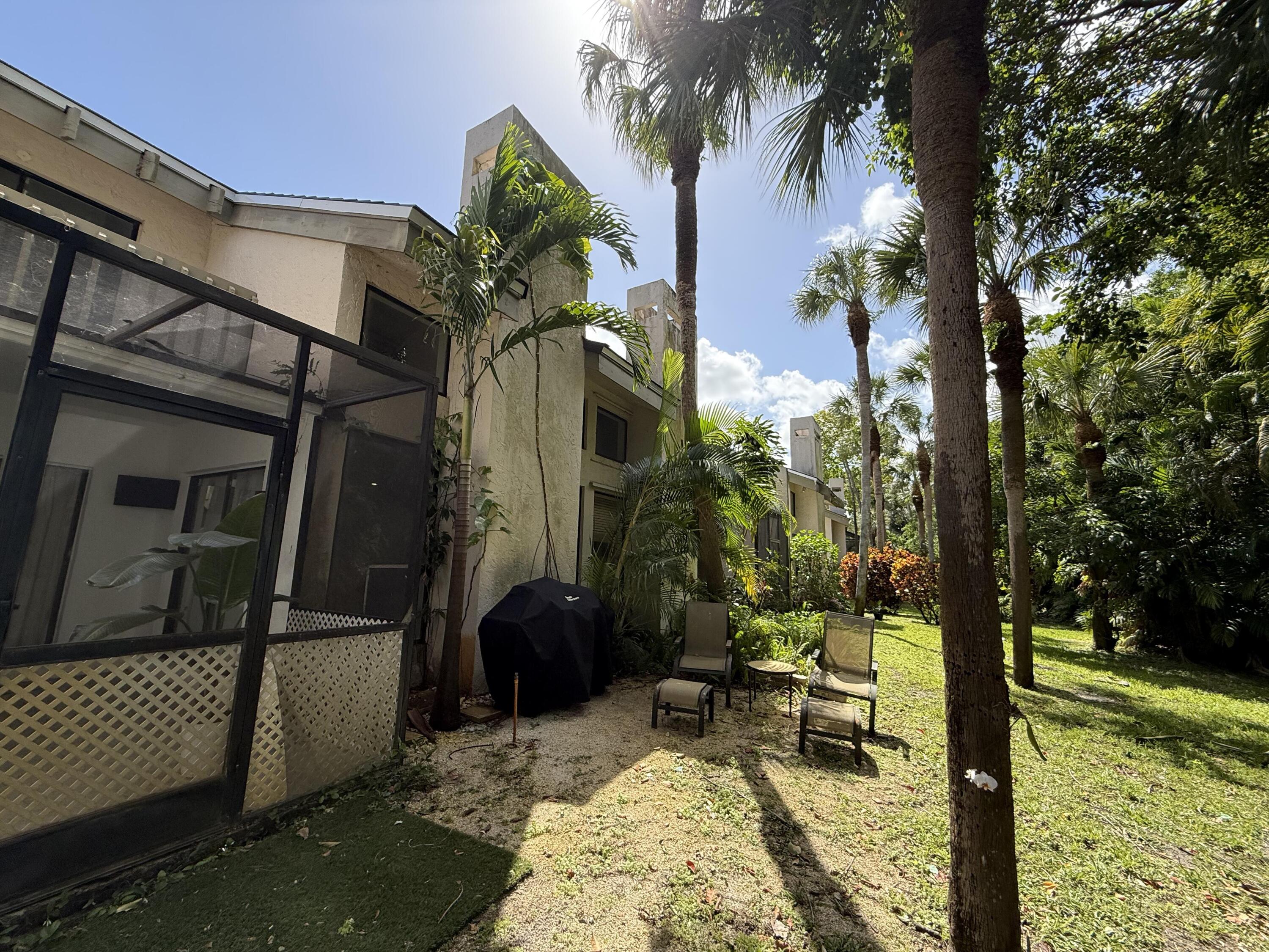 22874 Ironwedge Drive Boca Raton, FL 33433 - Photo 45 of 52 a view of a house with backyard and sitting area
