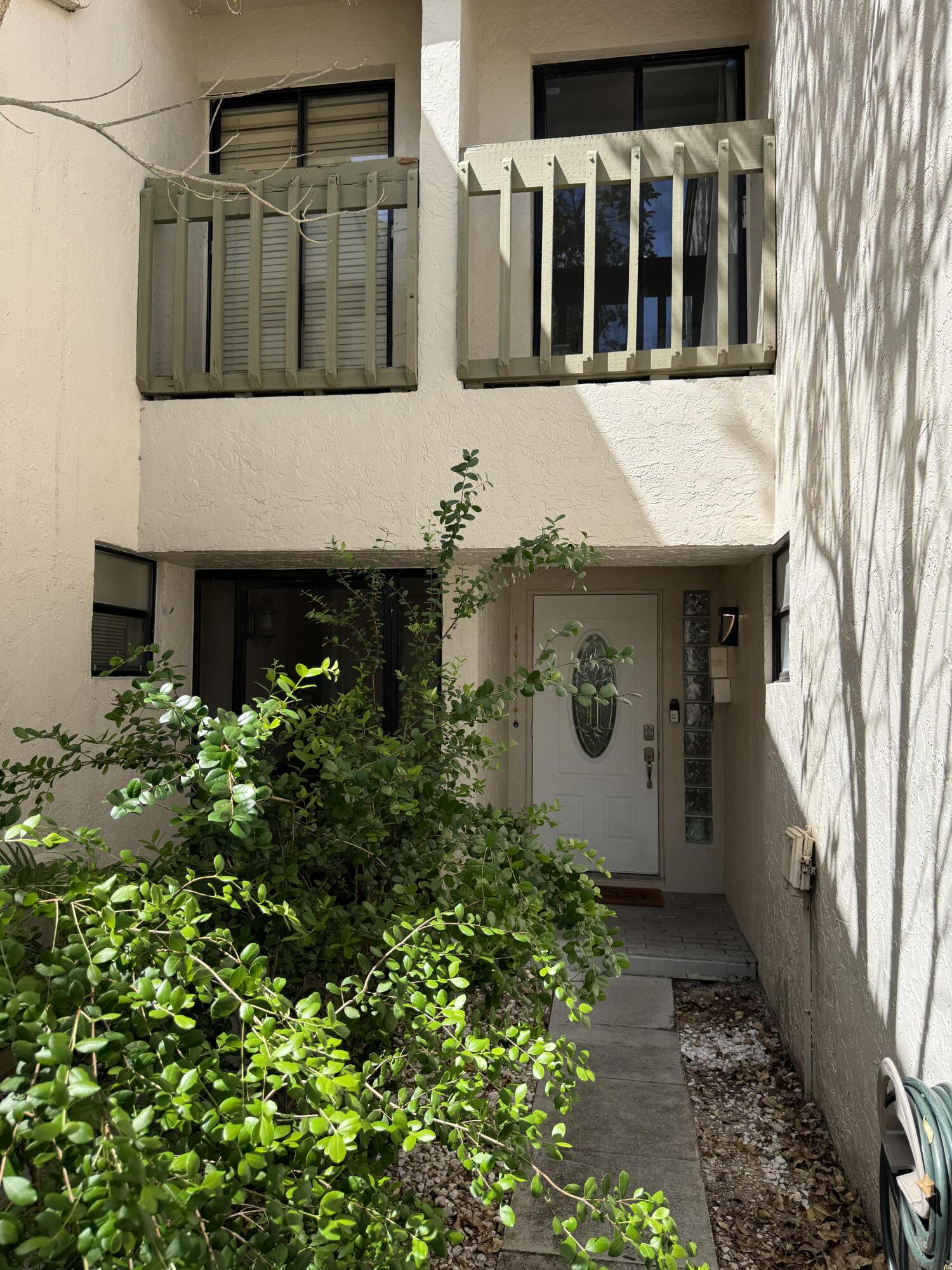 22874 Ironwedge Drive Boca Raton, FL 33433 - Photo 49 of 52 a view of a house with a flower garden