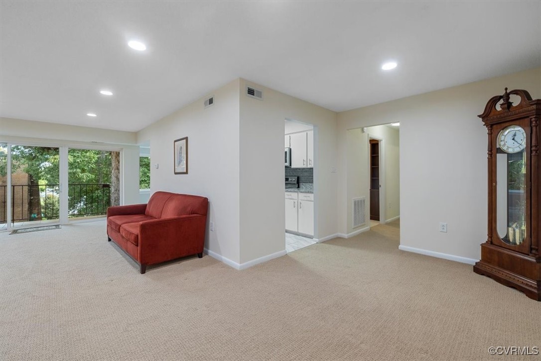 1501 Thistle Road, Unit 203 Richmond, VA 23238 - Photo 1 of 30 a living room with furniture and a window